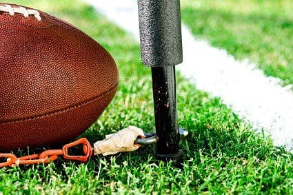 Close up of football inches from a first down