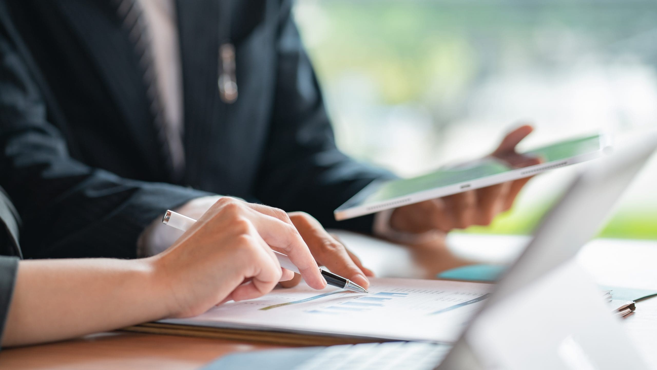 Young business teamwork working with business report document on