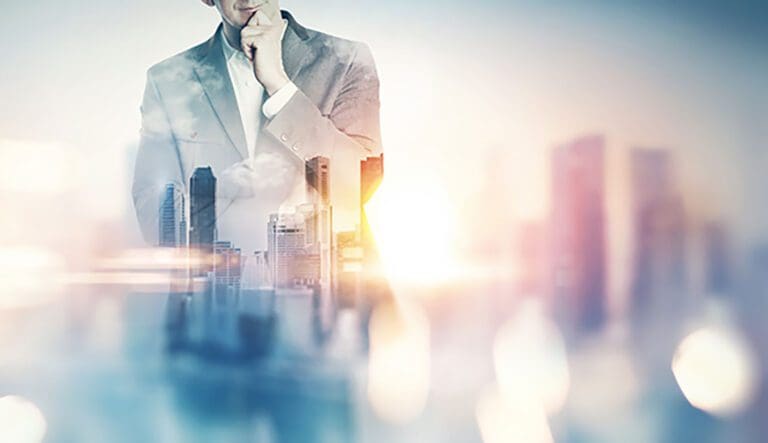 Double exposure of city and business man with light effects