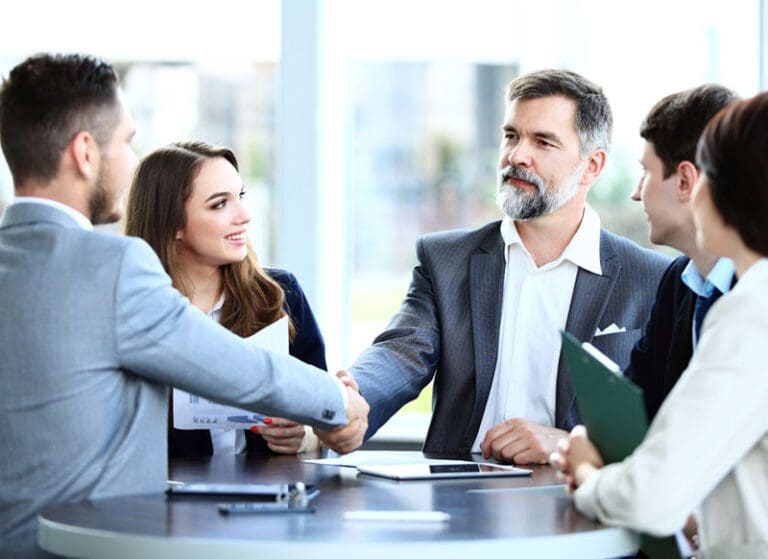 Business people shaking hands, finishing up a meeting