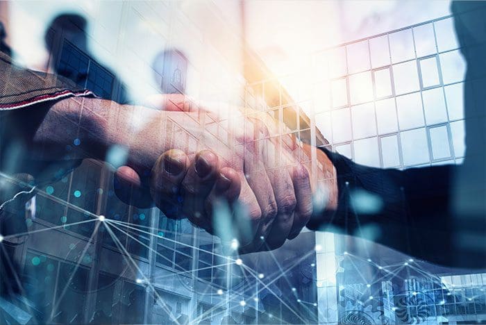 Handshaking business person in the office with network effect. concept of teamwork and partnership. double exposure