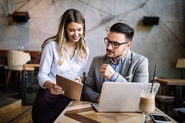 Two business colleagues at meeting in modern office interior