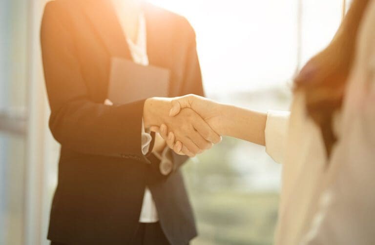 Close up of Business people shaking hands, finishing up meeting, business etiquette, congratulation, merger and acquisition concept