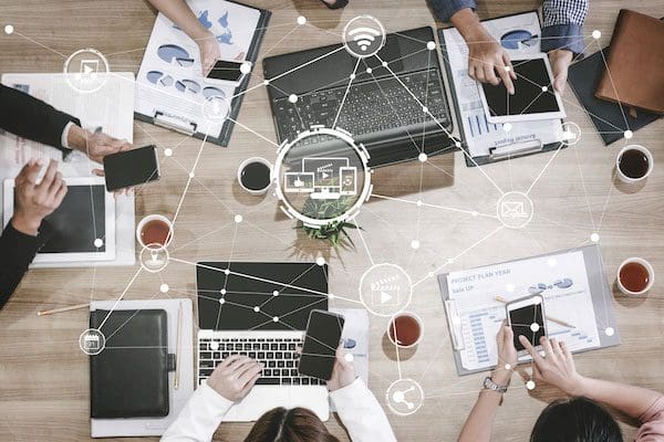 Multimedia and Computer Applications Concept. Business people using technology of digital gadget with modern graphic interface showing social, shopping, camera and multimedia application on device.