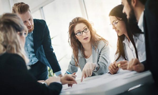 Meeting with woman speaking to everyone
