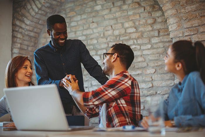 Good news handshake in the office