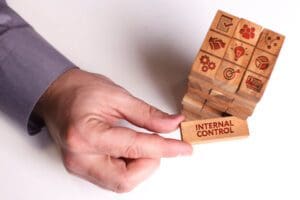 Business, Technology, Internet and network concept. Young businessman shows the word: Internal control
