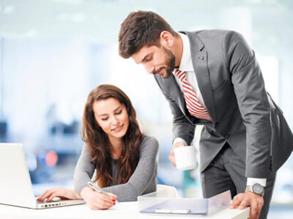 Two sales team members having a meeting