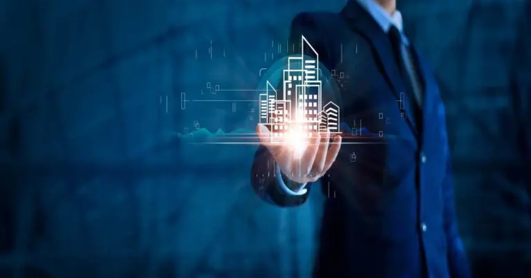 Businessman holding building of real estate icons. Engineering and construction. Investment and business development.