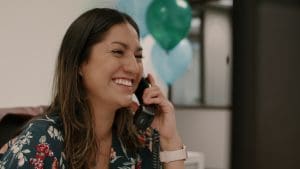 Receptionist talking on the phone at her desk at Bridgepoint Office