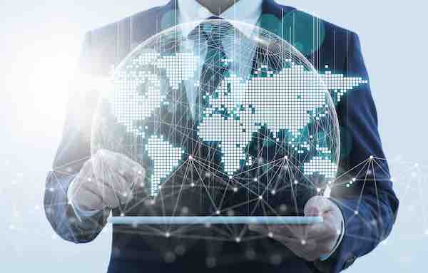 Global business and network technology. Business person using tablet computer. Network structure and world map.