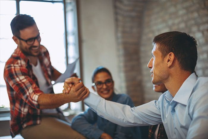 Good news handshake in the office